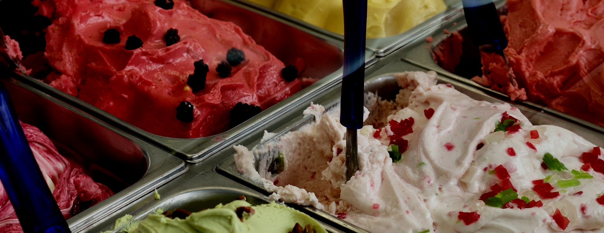Colorful display of gelato and ice cream flavors