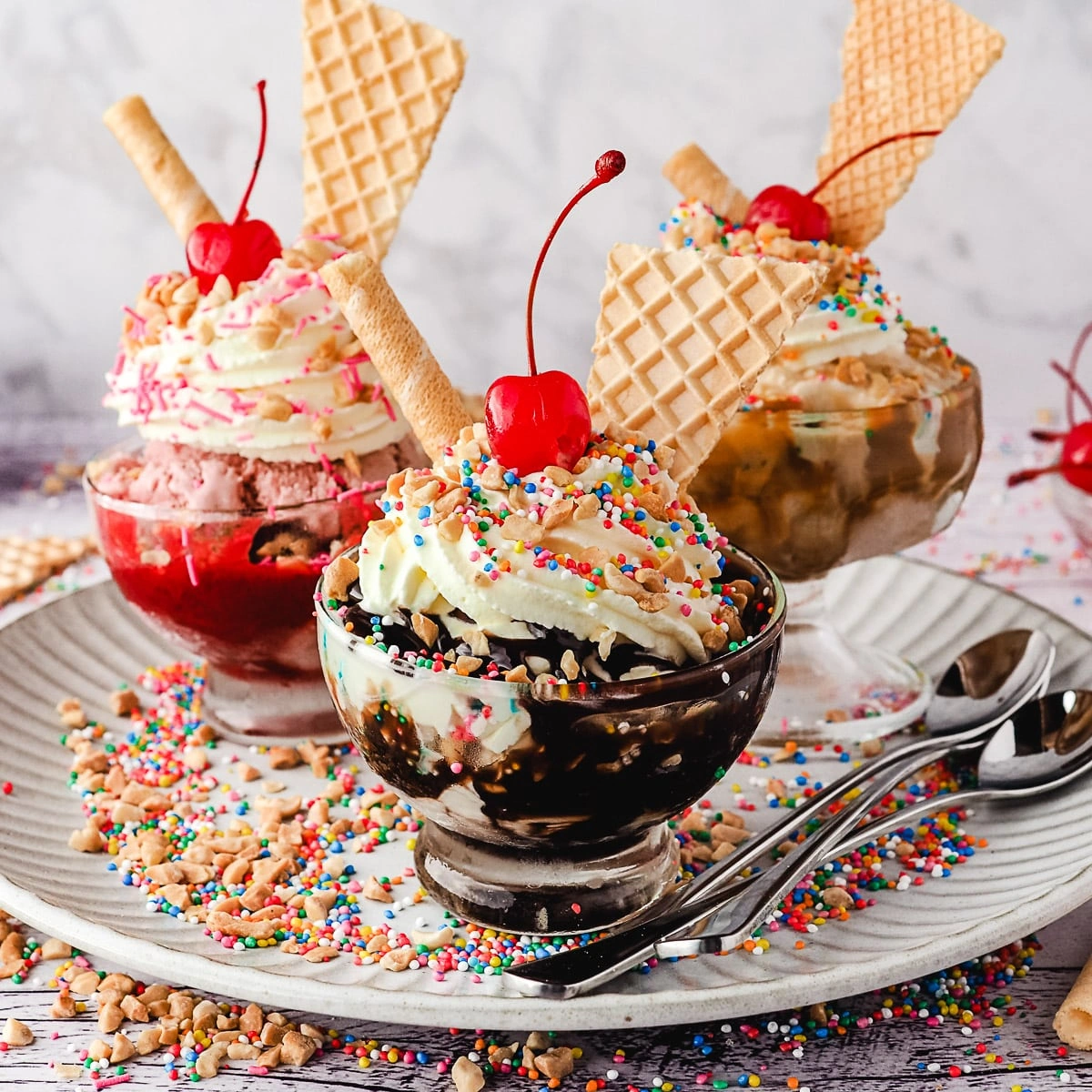 Ice cream sundaes with toppings and cherries